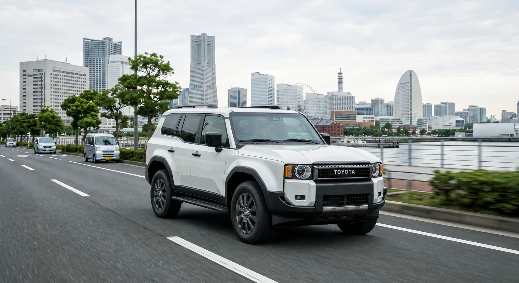 White Toyota Land Cruiser 250 driving beside Yokohama waterfront